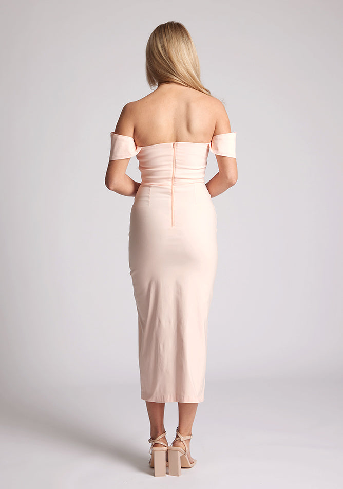 Front image of a model wearing a lake peach bardot midaxi dress with a stunning bardot neckline with armbands and a front skirt split. The design featured is the Vesper Astra Peach Bardot Midaxi Dress