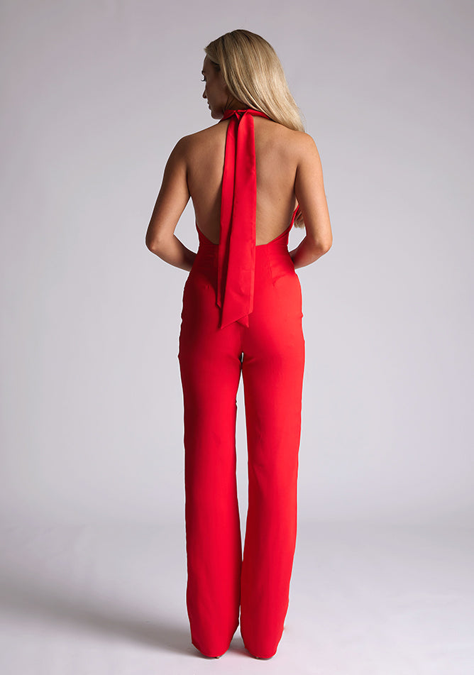 Back image of blonde model red collar detail jumpsuit with a strapless design and halter neck, this jumpsuit offers both comfort and sophistication. The designed featured is the Vesper Cindy Red Collar Detail Jumpsuit
