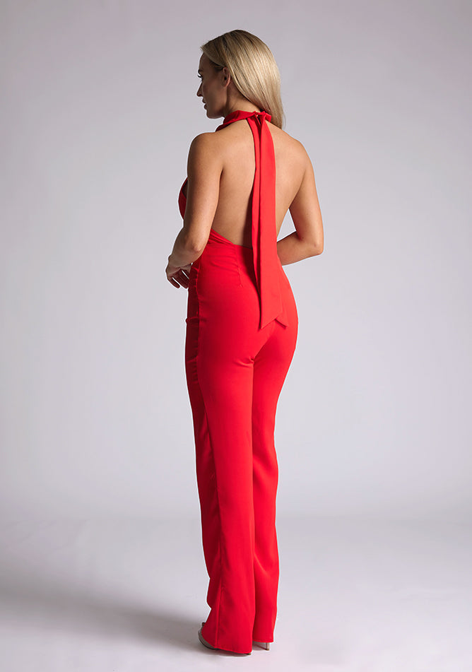 Back quarter image of blonde model red collar detail jumpsuit with a strapless design and halter neck, this jumpsuit offers both comfort and sophistication. The designed featured is the Vesper Cindy Red Collar Detail Jumpsuit