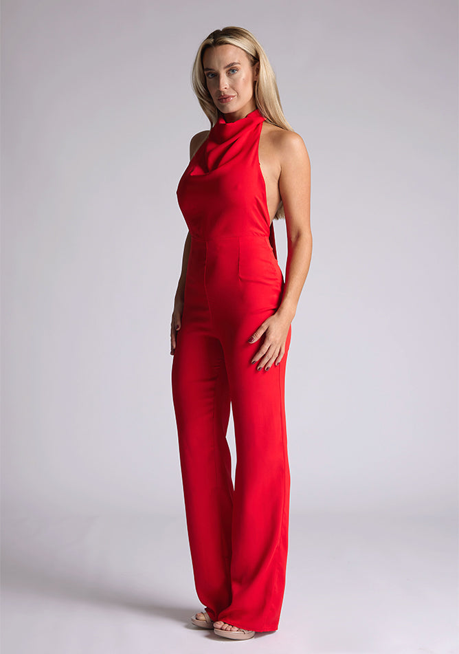Front quarter image of blonde model red collar detail jumpsuit with a strapless design and halter neck, this jumpsuit offers both comfort and sophistication. The designed featured is the Vesper Cindy Red Collar Detail Jumpsuit