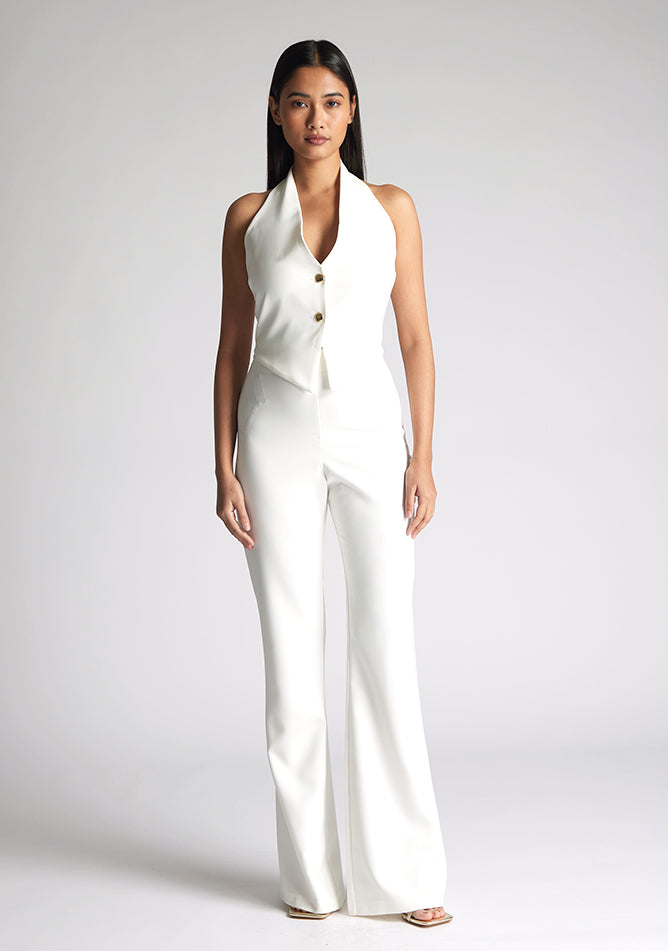 Front image of model wearing a ivory wide leg trousers with a flattering high waist and wide leg design. The design featured is the Vesper Connie Ivory Wide Leg Trousers paired with Vesper Eve Ivory Waistcoat