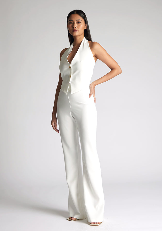 Front quarter image of model wearing a ivory wide leg trousers with a flattering high waist and wide leg design. The design featured is the Vesper Connie Ivory Wide Leg Trousers paired with Vesper Eve Ivory Waistcoat
