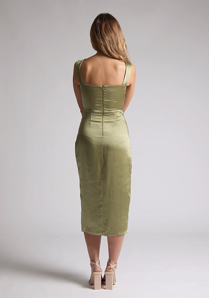 Back image of a model wearing olive satin midaxi dress with a sweetheart neckline, wide comfy straps and front skirt split. The dress featured is the Vesper Desiree Olive Satin Midaxi Dress
