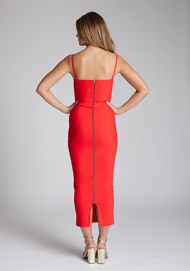 Back image of the model wearing a red midaxi dress with a sweetheart neckline that accentuates your neckline beautifully, bodycon fit and centre gold back zip. The design featured is the Vesper Zoya Red Midaxi Dress