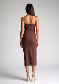 Back image of the model wearing a Chocolate Midaxi Dress with a straight-across neckline and delicate thin straps, and a front skirt split, a design features Vesper Alyssa Chocolate Midaxi Dress