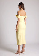 Quarter back image of a model wearing a yellow bardot dress, with a front split. The dress featured is the Astra sherbert bardot midaxi dress