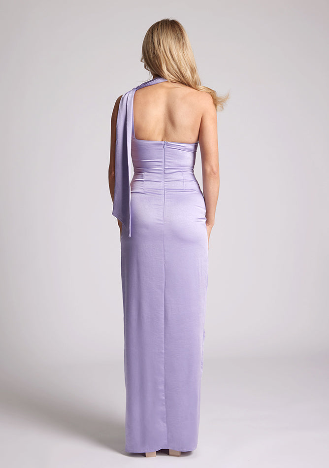 Back  image of a model wearing a lilac maxi evening dress with asymmetric neckline, front skirt split and statement collar drape detail, item featured is Vesper Cordula Lilac Collar Detail Maxi Dress
