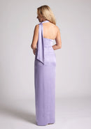 Back quarter  image of a model wearing a lilac maxi evening dress with asymmetric neckline, front skirt split and statement collar drape detail, item featured is Vesper Cordula Lilac Collar Detail Maxi Dress