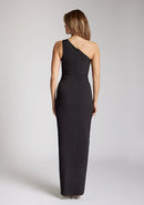 Back image of blonde model wearing a One Shoulder Black Maxi Dress with an asymmetric neckline and a daring thigh-high leg slit and a front cut-out, design features Vesper Fliss One Shoulder Black Maxi Dress