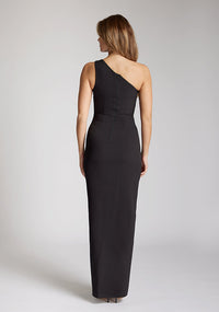 Back image of blonde model wearing a One Shoulder Black Maxi Dress with an asymmetric neckline and a daring thigh-high leg slit and a front cut-out, design features Vesper Fliss One Shoulder Black Maxi Dress