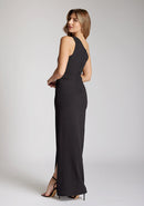 Quarter back image of blonde model wearing a One Shoulder Black Maxi Dress with an asymmetric neckline and a daring thigh-high leg slit and a front cut-out, design features Vesper Fliss One Shoulder Black Maxi Dress