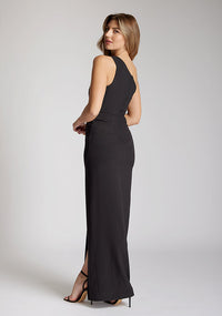 Quarter back image of blonde model wearing a One Shoulder Black Maxi Dress with an asymmetric neckline and a daring thigh-high leg slit and a front cut-out, design features Vesper Fliss One Shoulder Black Maxi Dress