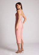 Quarter back image of a model wearing a peach midaxi dress with a cut out under the bust. The dress featured is the Frances peach midaxi dress\