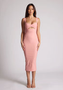 Front image of a model wearing a peach midaxi dress with a cut out under the bust. The dress featured is the Frances peach midaxi dress