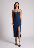Front image of a model wearing a navy dress with two cut out sections at the bust. The dress featured is the Kendall navy midaxi dress