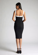 Back image of the model wearing a Monochrome Midi Dress with a square neckline with wide straps, and a bodycon fit, a design features Vesper Kylin Monochrome Midi Dress