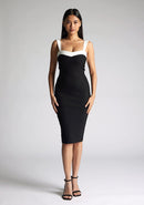 Front image of the model wearing a Monochrome Midi Dress with a square neckline with wide straps, and a bodycon fit, a design features Vesper Kylin Monochrome Midi Dress