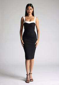 Front image of the model wearing a Monochrome Midi Dress with a square neckline with wide straps, and a bodycon fit, a design features Vesper Kylin Monochrome Midi Dress
