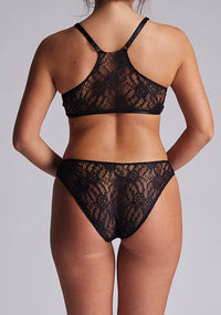 Back view of the Luxe Element Luna Brief featuring a full lace back with intricate floral pattern, offering a seductive yet sophisticated finish.