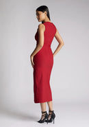 Back quarter  image of a model wearing a wine midaxi dress, featuring a cut out at the front and asymmetric straps. The dress featured is the Vesper Queenie wine midaxi dress