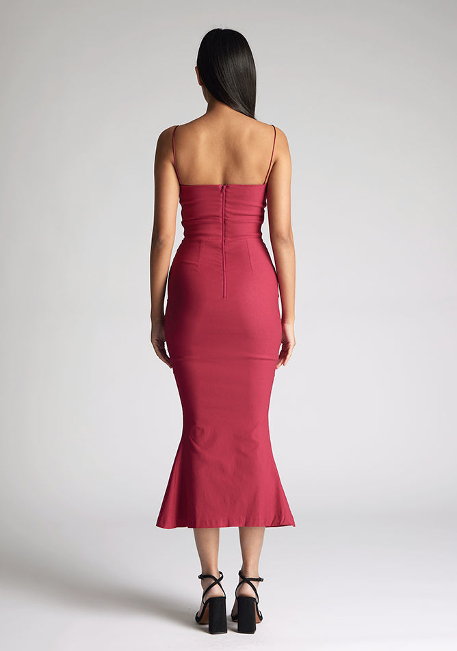 Back image of the model wearing a Raspberry Midaxi Dress with a sweetheart neckline with a thin straps, and a slim fit, a design features Vesper Roisin Raspberry Midaxi Dress