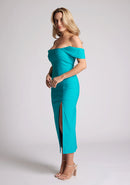 Front quarter image of a model wearing a lake green bardot dress with a  stunning bardot neckline with armbands and a front skirt split. The design featured is the Vesper Astra lake Green Bardot Midaxi Dress