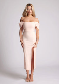 Front image of a model wearing a lake peach bardot midaxi dress with a  stunning bardot neckline with armbands and a front skirt split. The design featured is the Vesper Astra Peach Bardot Midaxi Dress