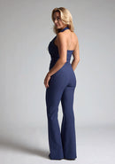 Back quarterimage of a model wearing navy wide leg trousers with a flattering high waist and wide leg design. The design featured is the Vesper Connie Navy Wide Leg Trousers paired with Vesper Eve Navy Waistcoat