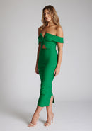 Front quarter image of a model wearing a emerald green midaxi dress with a off-shoulder bardot neckline, with arm bands v-shaped cut-out at neckline and keyhole cut-out under bust and bodycon style dress with a statement gold zip at centre back. The design featured is the Vesper Daphne Emerald Green Midaxi Dress