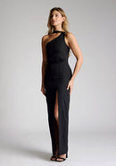 Front quarter image of a model wearing a black maxi dress with a featuring  front split and one shoulder strap with another going across the neck. The design featured is the Vesper Gizelle black maxi dress