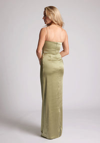 Quarter Back image of a model wearing an Olive Green Maxi Dress with a scoop neckline, thin straps, an asymmetric strap detail, subtle pleat detail at side of hip. The&nbsp; dress featured is Vesper Lorah Olive Maxi Dress.