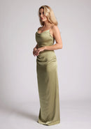 Quarter Front image of a model wearing an Olive Green Maxi Dress with a scoop neckline, thin straps, an asymmetric strap detail, subtle pleat detail at side of hip. The&nbsp; dress featured is Vesper Lorah Olive Maxi Dress.