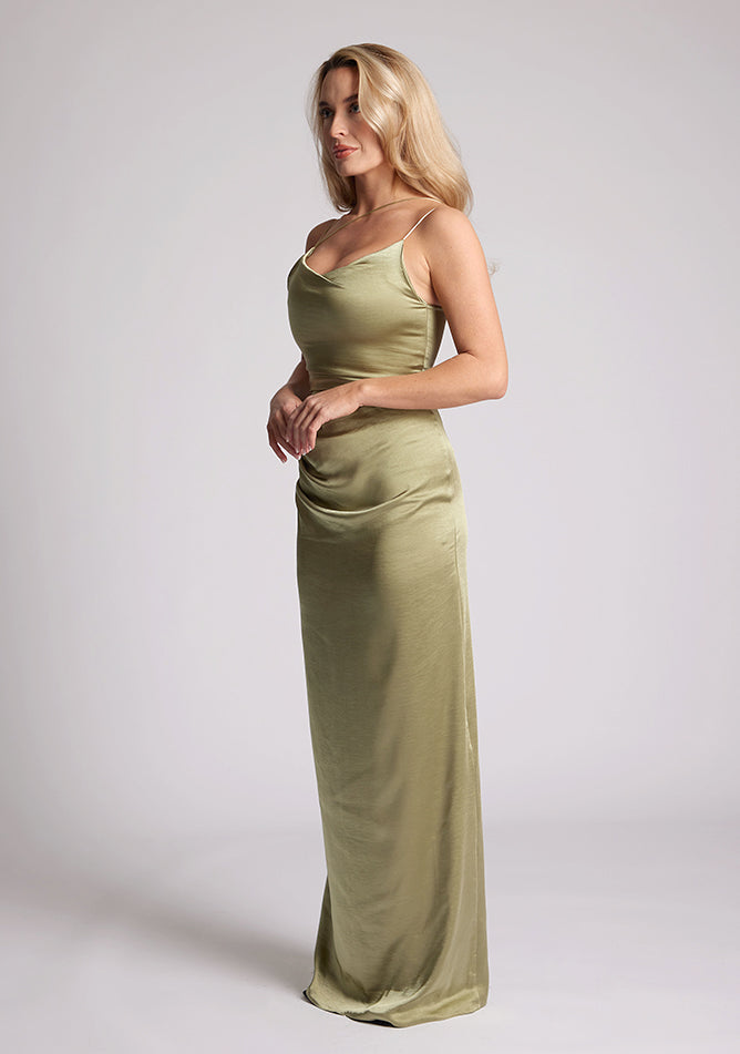 Quarter Front image of a model wearing an Olive Green Maxi Dress with a scoop neckline, thin straps, an asymmetric strap detail, subtle pleat detail at side of hip. The&nbsp; dress featured is Vesper Lorah Olive Maxi Dress.