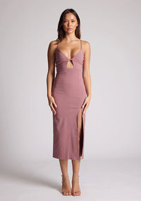 Front image of a model wearing a rose pink midaxi dress, featuring a plunging neckline with thin straps, a front bodice cut-out and front skirt split. The dress featured is the Vesper Martina Rose Cut-Out Midaxi Dress.&nbsp;