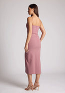 Quarter back image of a model wearing a rose pink midaxi dress, featuring a plunging neckline with thin straps, a front bodice cut-out and front skirt split. The dress featured is the Vesper Martina Rose Cut-Out Midaxi Dress.&nbsp;