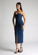 Front quarter image of  model wearing a navy strappy midaxi dress with a sweetheart neckline, thin straps, centre front skirt split and centre back zip for a perfect fit. The design featured is the Vesper Miren Navy Strappy Midaxi Dress