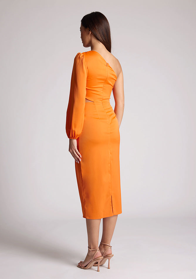 Quarter back image of a model wearing an orange midi  dress, featuring an asymmetric neckline with one sleeve, with a side waist cut-out detail.The dress featured is the Vesper Niccola Orange Midi Dress.