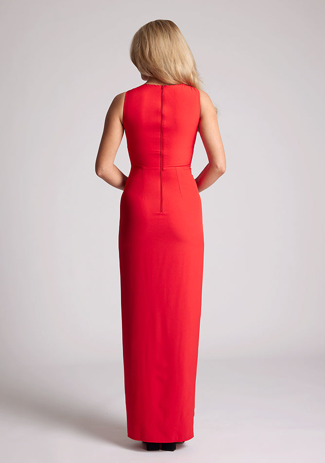 Back  image of a model wearing a Red Asymmetrical Detail Maxi Dress with a bold asymmetric neckline, front leg split and centre back zip fastening. The design features Vesper Polly Red Asymmetrical Maxi Dress