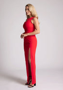 Front quarter image of a model wearing a Red Asymmetrical Detail Maxi Dress with a bold asymmetric neckline, front leg split and centre back zip fastening. The design features Vesper Polly Red Asymmetrical Maxi Dress