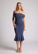 Front image of the model wearing a navy polka bardot midaxi dress with a classy bardot neckline with arm bands and frill hem detail. The design featured is the Vesper Racquel Navy Polka Dot Bardot Midaxi DressFront image of the model wearing a navy polka bardot midaxi dress with a classy bardot neckline with arm bands and frill hem detail. The design featured is the Vesper Racquel Navy Polka Dot Bardot Midaxi Dress