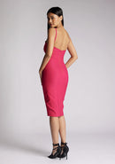 Back quarter image of a model wearing a cerise midi dress with a chic square neckline and slender straps, exuding sophistication and grace. The design featured is the Vesper Raye Cerise Midi Dress