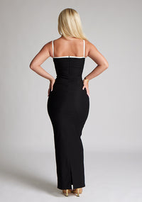 Back image of a  model wearing a monochrome maxi dress with a square neckline with thin straps and a bodycon fit. The design featured is the Vesper Sienna Monochrome Bodycon Maxi Dress