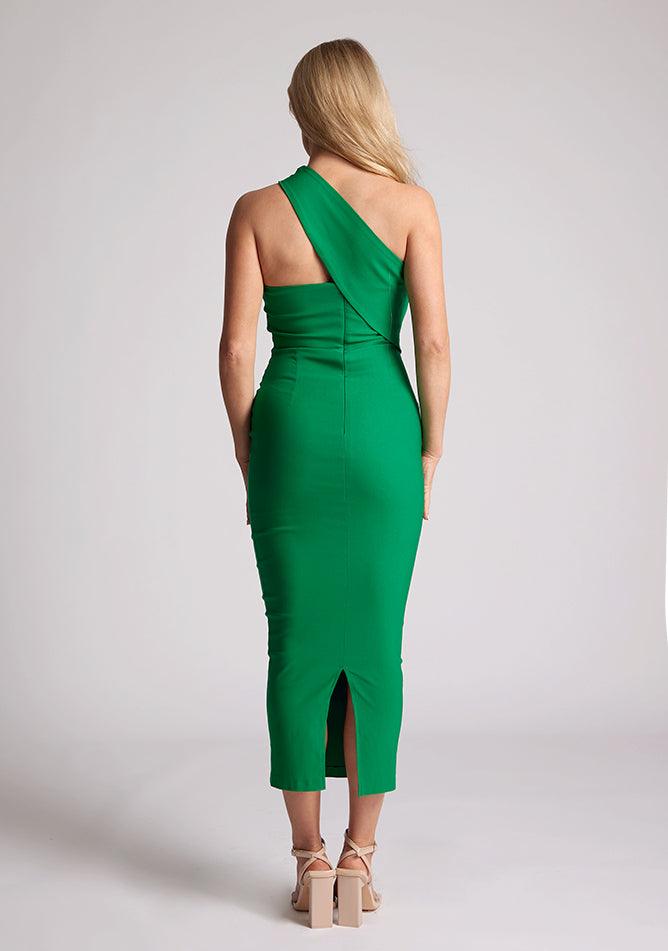 Back image of blonde model wearing  emerald one shoulder midaxi dress with a unique one-sleeve design, asymmetric cut neckline, bycon fit, back zip and closure short split. The design featured is the Vesper Teo Emerald One Shoulder Midaxi Dress