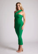 Front quarter image of blonde model wearing  emerald one shoulder midaxi dress with a unique one-sleeve design, asymmetric cut neckline, bycon fit, back zip and closure short split. The design featured is the Vesper Teo Emerald One Shoulder Midaxi Dress