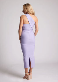 Back quarter image of blonde model wearing lilac one shoulder midaxi dress with a unique one-sleeve design, asymmetric cut neckline, bycon fit, back zip and closure short split. The design featured is the Vesper Teo Lilac One Shoulder Midaxi Dress