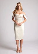 Front image of model wearing a cream satin bardot midi dress with a  delicate allure satin, cowl neckline and invisible back zip with thin straps and draped arm bands.  The design featured is the Vesper Victoria Cream Satin Bardot Midi Dress