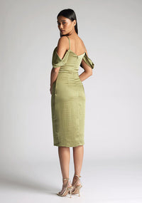 Back quarter image of model wearing a olive satin bardot midi dress with a  delicate allure satin, cowl neckline and invisible back zip with thin straps and draped arm bands.  The design featured is the Vesper Victoria Olive Satin Bardot Midi Dress