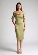Front image of model wearing a olive satin bardot midi dress with a  delicate allure satin, cowl neckline and invisible back zip with thin straps and draped arm bands.  The design featured is the Vesper Victoria Olive Satin Bardot Midi Dress