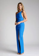 Front quarter image of a model wearing a cobalt blue maxi dress with a asymmetric neckline, one shoulder strap, front skirt split and open back with asymmetric strap across back. The design featured is the Vesper Viva Cobalt One Shoulder Maxi Dress.