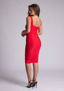 Back quarter image of model wearing a red pencil dress with a square-cut neckline and straps and a bodycon fit. The design features is the Vesper Zada Red Bodycon Pencil Midi Dress